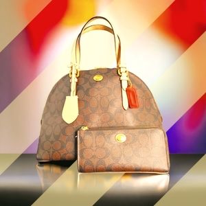 The brown and tan Coach satchel handbag with a matching wallet is a coordinated